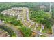 Aerial view of a suburban neighborhood with well-maintained lawns and tree-lined streets at 306 Lark Ln, Canton, GA 30115