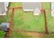Aerial view of a large, well-maintained backyard with a wooden fence and a storage shed at 306 Lark Ln, Canton, GA 30115