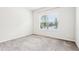 Minimalist bedroom featuring carpet and a window providing natural light and a view of the street at 306 Lark Ln, Canton, GA 30115