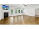 Bright living room with hardwood floors, fireplace, and large windows providing lots of natural light at 306 Lark Ln, Canton, GA 30115