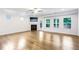 Spacious living area with hardwood floors, a fireplace, and large windows offering backyard views at 306 Lark Ln, Canton, GA 30115