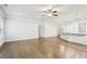 Open living space with hardwood floors, recessed lighting, and a granite island that adjoins the kitchen at 306 Lark Ln, Canton, GA 30115
