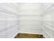 Walk-in pantry with wire shelving and hardwood floors at 306 Lark Ln, Canton, GA 30115