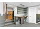 The basement features a wet bar, shelves, and a mini fridge for convenience at 3116 Lakepoint Cir, Acworth, GA 30102