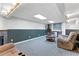 Basement area with comfortable seating, fireplace, and wet bar for entertaining at 3116 Lakepoint Cir, Acworth, GA 30102