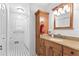 Renovated bathroom with updated granite countertop and white tiled walls, plus a shower and plenty of storage at 3116 Lakepoint Cir, Acworth, GA 30102