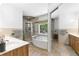 This bathroom features a double sink, a glass shower, a soaking tub, and a large window at 3116 Lakepoint Cir, Acworth, GA 30102