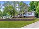 Charming split-level home with brick accents, mature trees, and a well-maintained lawn at 3116 Lakepoint Cir, Acworth, GA 30102