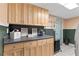 Convenient laundry room with upper and lower cabinets, and a countertop for folding and sorting laundry at 3116 Lakepoint Cir, Acworth, GA 30102
