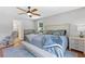 Bright main bedroom features a ceiling fan, en-suite bathroom, and space for a crib or rocking chair at 3116 Lakepoint Cir, Acworth, GA 30102