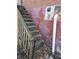 Back exterior stairs leading up to the house with painted walls at 6 Rockmart Sw Dr, Atlanta, GA 30314