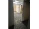 Unfinished basement with painted block walls and doorway to utility area at 6 Rockmart Sw Dr, Atlanta, GA 30314