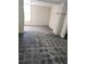 Unfinished basement with worn tile and visible utility pipes along the ceiling at 6 Rockmart Sw Dr, Atlanta, GA 30314