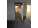 Basement features cinder block walls, view to basement bathroom and another room at 6 Rockmart Sw Dr, Atlanta, GA 30314