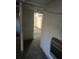 Basement space featuring concrete walls and view into another room at 6 Rockmart Sw Dr, Atlanta, GA 30314