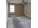 Bedroom featuring neutral walls, large window, and a ceiling fan at 6 Rockmart Sw Dr, Atlanta, GA 30314