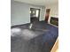 Spacious living room with blue carpet and fireplace at 6 Rockmart Sw Dr, Atlanta, GA 30314