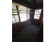 Sun room with wood paneling and checkered tile floor at 6 Rockmart Sw Dr, Atlanta, GA 30314