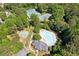 Aerial view of community amenities featuring a swimming pool, tennis courts, and a basketball court at 11040 Regal Forest Dr, Johns Creek, GA 30024