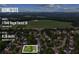 Aerial view of community featuring approximate lot lines, homesites, and the surrounding landscape at 11040 Regal Forest Dr, Johns Creek, GA 30024