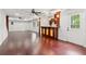 Finished basement with a beautiful bar, hardwood floors, neutral walls, and access to the outside at 11040 Regal Forest Dr, Johns Creek, GA 30024