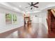 Finished basement with beautiful hardwood floors, bar, and access to the backyard at 11040 Regal Forest Dr, Johns Creek, GA 30024