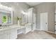 Large bathroom with double sinks, vanities, and ample storage space with neutral paint at 11040 Regal Forest Dr, Johns Creek, GA 30024