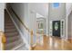 A spacious foyer with hardwood floors and a staircase leading to the second floor at 11040 Regal Forest Dr, Johns Creek, GA 30024