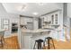 Kitchen with granite countertops, stainless steel appliances, and a breakfast bar at 11040 Regal Forest Dr, Johns Creek, GA 30024