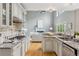 Gourmet kitchen featuring modern appliances, granite counters, and gas range at 11040 Regal Forest Dr, Johns Creek, GA 30024