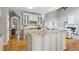 Stylish kitchen with granite countertops, island, and open view to living area at 11040 Regal Forest Dr, Johns Creek, GA 30024