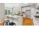 Well-equipped kitchen with granite counters, ample cabinetry, and wood flooring at 11040 Regal Forest Dr, Johns Creek, GA 30024