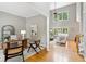 Cozy living room with a desk area, hardwood floors, and an open floor plan at 11040 Regal Forest Dr, Johns Creek, GA 30024