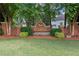 Brick neighborhood sign for RiverWalk, surrounded by lush landscaping and greenery at 11040 Regal Forest Dr, Johns Creek, GA 30024