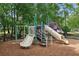 Community playground with slides, climbing structures, and mulch ground cover for enjoyment at 11040 Regal Forest Dr, Johns Creek, GA 30024