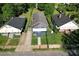 Aerial shot of a blue one-story home with well-maintained lawns, nestled between neighboring houses at 1286 Allene Sw Ave, Atlanta, GA 30310