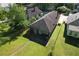 Aerial view of a blue one-story home with well-maintained lawn and a back patio area at 1286 Allene Sw Ave, Atlanta, GA 30310