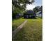View of the backyard with a well-maintained lawn and a glimpse of the home's exterior at 1286 Allene Sw Ave, Atlanta, GA 30310