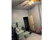 Bedroom featuring a ceiling fan, plastic bins and a door to the next room at 1286 Allene Sw Ave, Atlanta, GA 30310