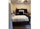 View of the bedroom with matching bed, tv stand and a ceiling fan at 1286 Allene Sw Ave, Atlanta, GA 30310