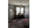 Dining room featuring a hanging crystal light fixture, vintage rug, and view through doorway at 1286 Allene Sw Ave, Atlanta, GA 30310