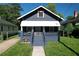 Charming one-story home with blue siding, covered porch, and well-maintained front lawn at 1286 Allene Sw Ave, Atlanta, GA 30310