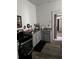 Kitchen featuring stainless steel oven, gray cabinets, and hardwood flooring at 1286 Allene Sw Ave, Atlanta, GA 30310