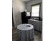 Kitchen area with black refrigerator, a table and gray cabinets at 1286 Allene Sw Ave, Atlanta, GA 30310