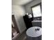 Kitchen area with black refrigerator, a table and gray cabinets at 1286 Allene Sw Ave, Atlanta, GA 30310