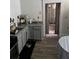 Kitchen featuring stainless steel oven, gray cabinets, and hardwood flooring at 1286 Allene Sw Ave, Atlanta, GA 30310