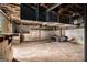 Spacious unfinished basement with concrete floor offers room for storage and projects at 1491 Boulderwoods Dr, Atlanta, GA 30316