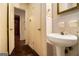 A well-lit half-bathroom with a pedestal sink at 1491 Boulderwoods Dr, Atlanta, GA 30316