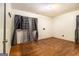 Hardwood floors and neutral walls give the bedroom a calm feel; natural light from the window at 1491 Boulderwoods Dr, Atlanta, GA 30316
