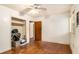 This bedroom has hardwood floors, a ceiling fan, and ample closet space at 1491 Boulderwoods Dr, Atlanta, GA 30316